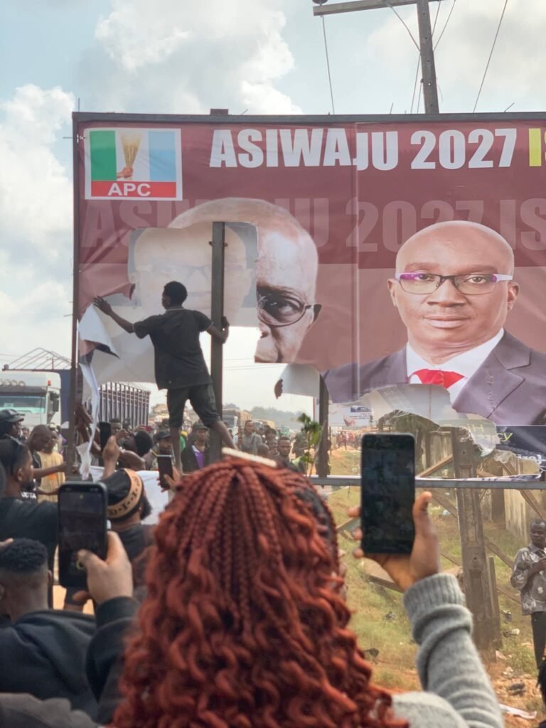 Edo youths tore Tinubu's banner to shreds in protest 